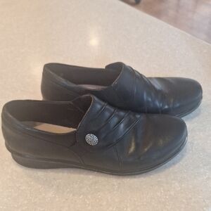 Ladies Clarks Black Leather Slip-On Loafers with Decorative Button